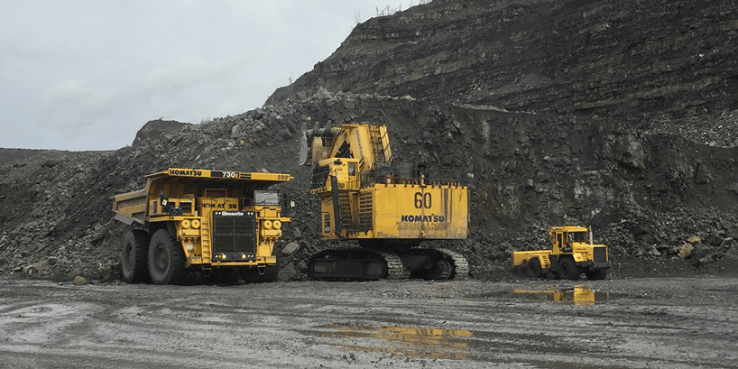 mining vehicles on field