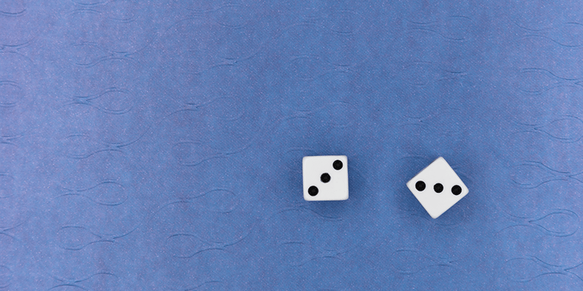 rolling dice on blue background